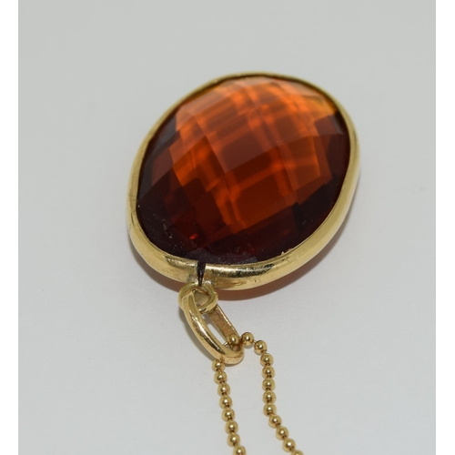 49 - Gold amber quartz pendant necklace.