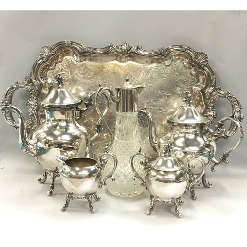 10 - Silver plated 4 piece teaset together a silver plate butlers tray and a claret jug