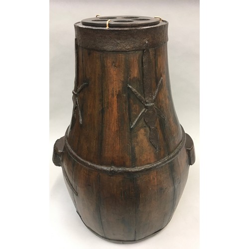 256 - Chinese hard wood brass bound barrel/rice carrier of baluster form with metal strap work decoration ... 