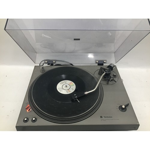 1210 - TECHNICS SL-1500 TURNTABLE. This direct drive record deck has some age related wear but works fine.