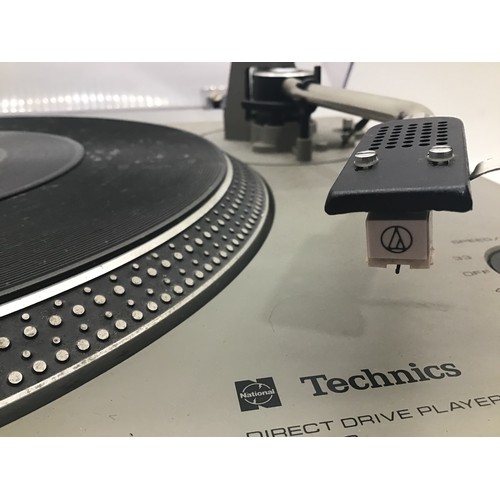 1210 - TECHNICS SL-1500 TURNTABLE. This direct drive record deck has some age related wear but works fine.