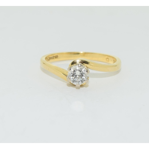 124 - Diamond solitaire 0.33points in 18ct gold twist ring.
