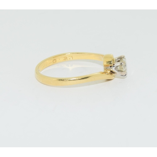 124 - Diamond solitaire 0.33points in 18ct gold twist ring.