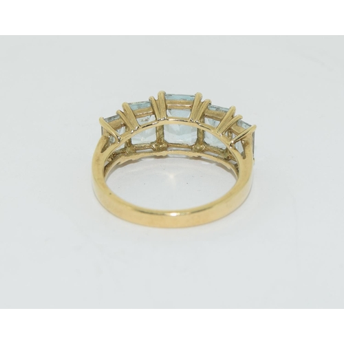 89 - Aquamarine 5 stone 9 carat gold ring Size J