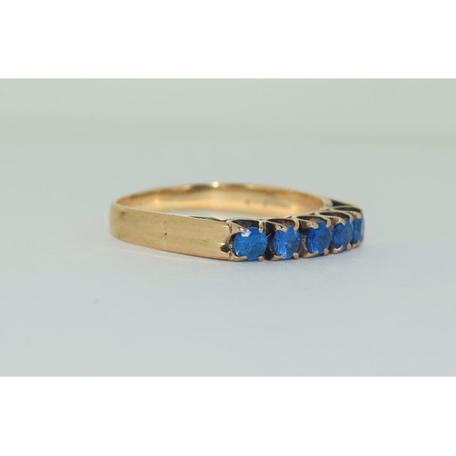 35 - 18ct gold ladies 5 stones blue topaz ring size O