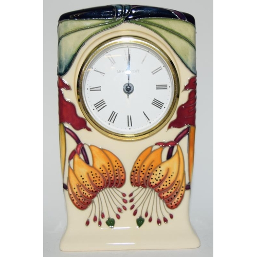 187 - Moorcroft Clock in the Anna Lily design by N. Sleeney 16cms high, fully marked & signed to base.