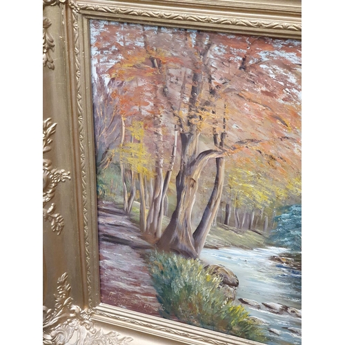 381 - Gilt framed oil on canvas of a river scene signed 126x95cm.