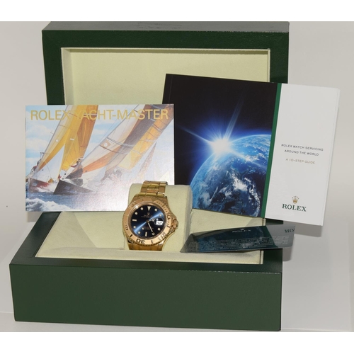45 - Rolex Yachtmaster 18ct gold model 16628. Electric blue face with Rolex service card and boxed. (ref ... 