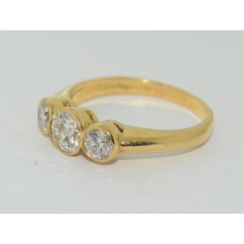 1081 - An 18ct yellow gold three stone diamond ring of approx 1.2cts. size O