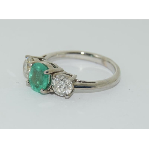 1091 - An 18ct white gold emerald and diamond three stone ring of approx  2cts.Size K