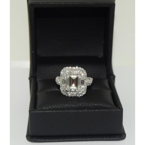 1092 - 18ct white gold ladies Emerald cut center stone diamond ring with diamond halo surround of 68 diamon... 