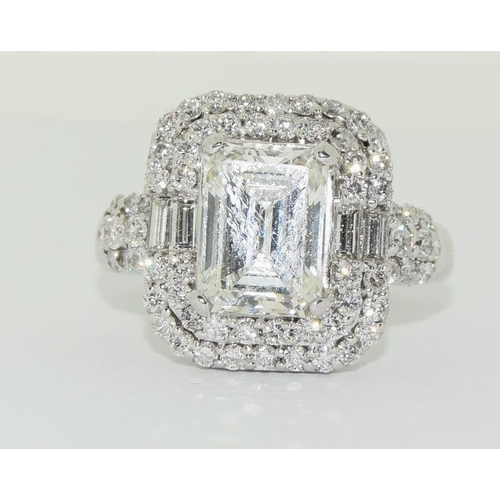 1092 - 18ct white gold ladies Emerald cut center stone diamond ring with diamond halo surround of 68 diamon... 