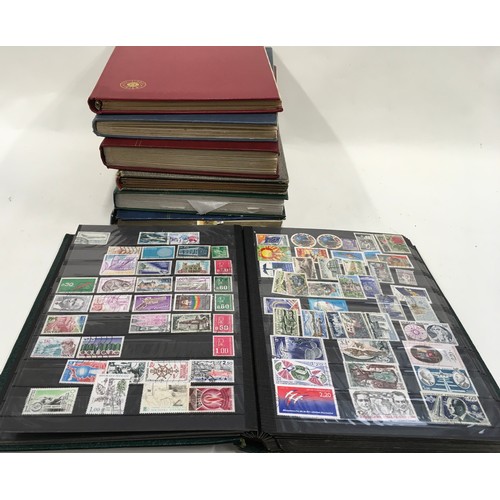 45 - 6 stockbooks of world stamps plus one empty stockbook, 7 in all.