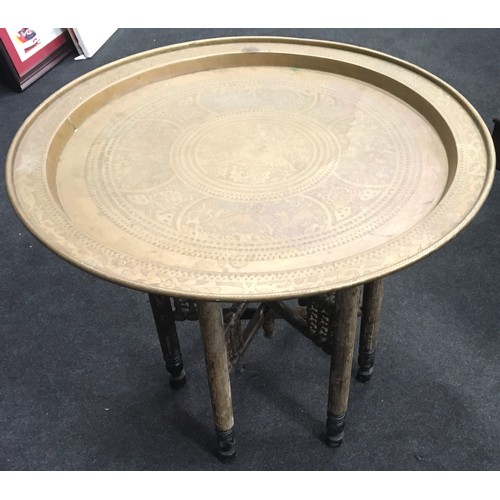 342 - A folding brass tray topped table. Table top approx 28” across.