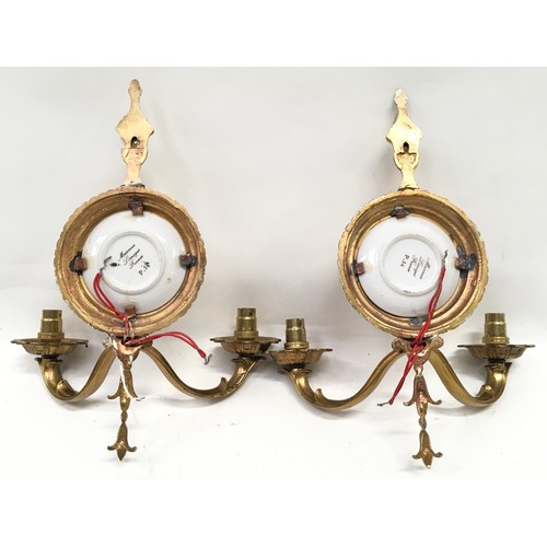 209 - A pair of decorative brass wall sconces with Meissen Limoges pictoral plaques together with a three ... 