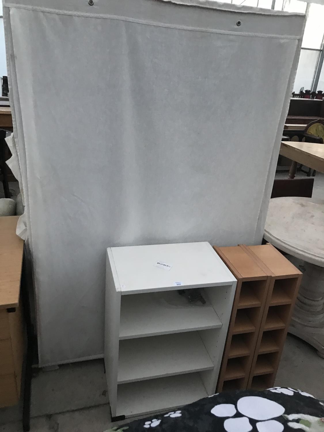 A Pine And Linen Wardrobe A Small White Bookcase And Two Small