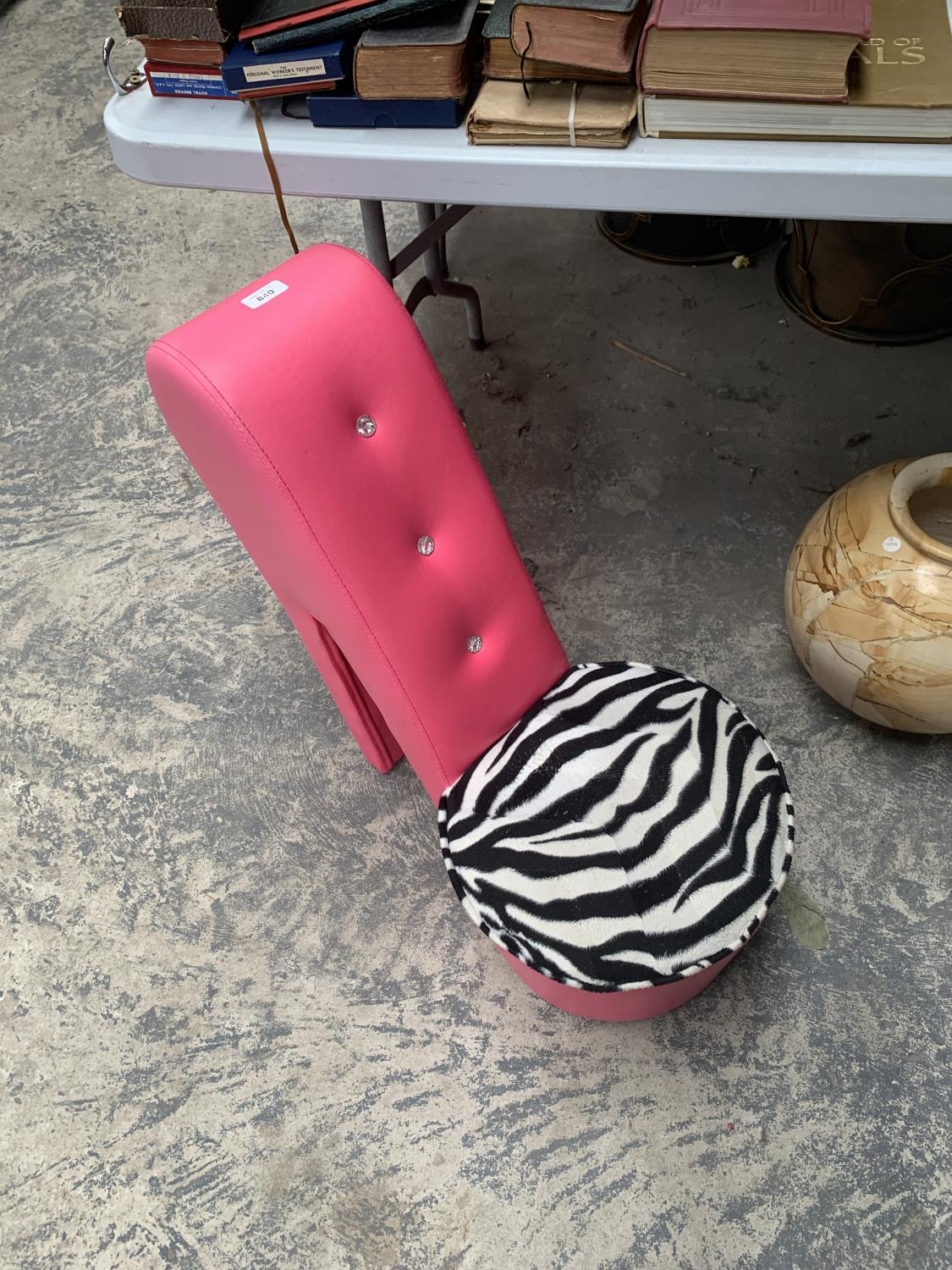 A Pink Faux Leather Shoe Shaped Chair