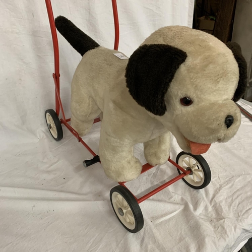 stuffed dog on wheels