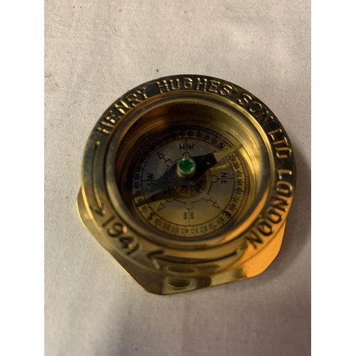 A HENRY HUGHES SON LTD BRASS COMPASS MADE FOR THE ROYAL NAVY AND DATED