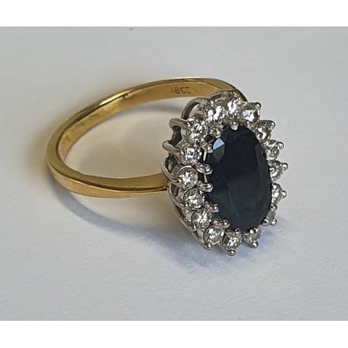 1004a - A fantastic 18ct gold, Sapphire and Diamond Ring. The center Sapphire being 2.8ct. Size R