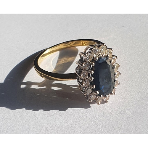 1004a - A fantastic 18ct gold, Sapphire and Diamond Ring. The center Sapphire being 2.8ct. Size R