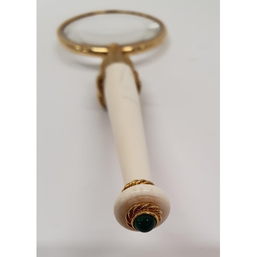 820 - A heavy 18ct gold Magnifying Glass with horses head and Ivorine handle.L 17 cms.