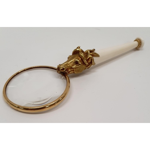 820 - A heavy 18ct gold Magnifying Glass with horses head and Ivorine handle.L 17 cms.