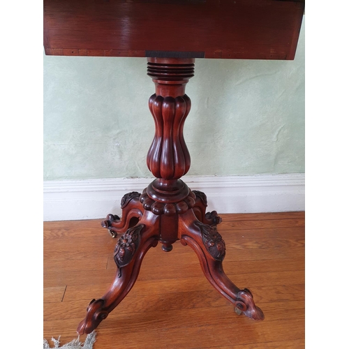 11 - A late 19th early 20th Century oval Walnut Side Table with drop leaves on a turned carved base, carv... 