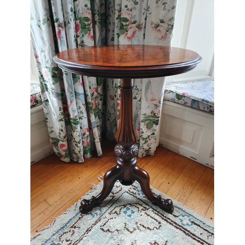 17 - A 19th Century Walnut Crossbanded Circular Wine Table with a highly carved fluted tripod base and fl... 