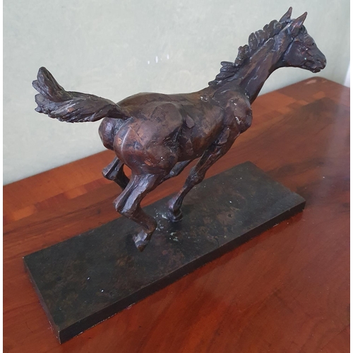 25 - A Bronze Sculpture of a Racehorse. Signed Arnup. H23 x D10 X W33cm approx.
