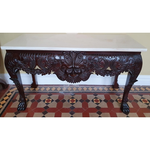 39 - A fantastic Irish Mask Table in the Georgian style with highly carved front, hairy paw feet and marb... 