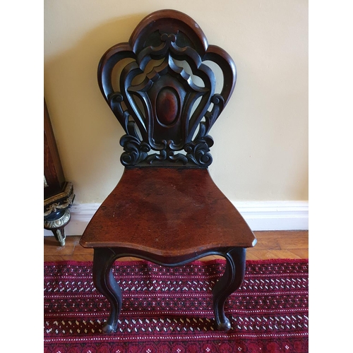 57 - A good pair of early 19th Century Mahogany Hall Chairs with highly pierced backs and heavy solid sea... 