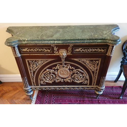 58 - A Superb pair of Mahogany Side Cabinets profusely mounted with ormolu mounts. On turned supports and... 