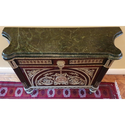 58 - A Superb pair of Mahogany Side Cabinets profusely mounted with ormolu mounts. On turned supports and... 