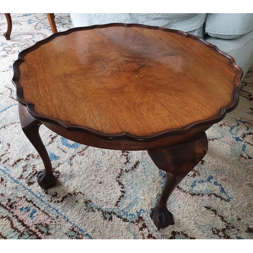 7 - An Edwardian Walnut low Side Table with scalloped edge on ball and claw feet. Diam.60 x H39cm approx... 