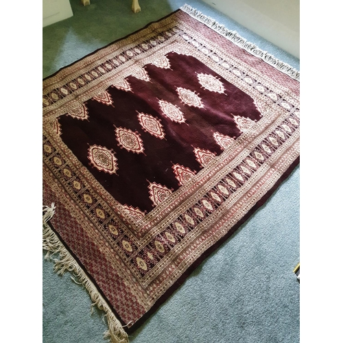 520 - A Brown Bokhara style Rug. 170 x 134cm approx.