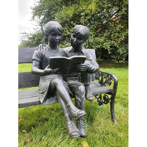 773 - A Fabulous Bronze Sculpture of a Boy and a Girl on a bench reading. H92 x D67 x W100cm approx.