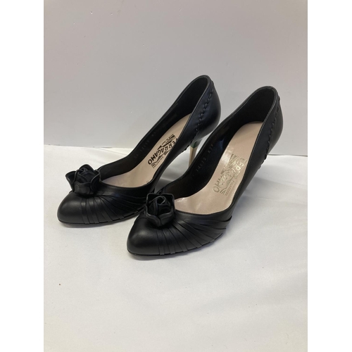 31 - Salvatore Farragamo Black leather Vara Pumps with rose on toe and gold heel. Size 7.5 C (US). Serial... 