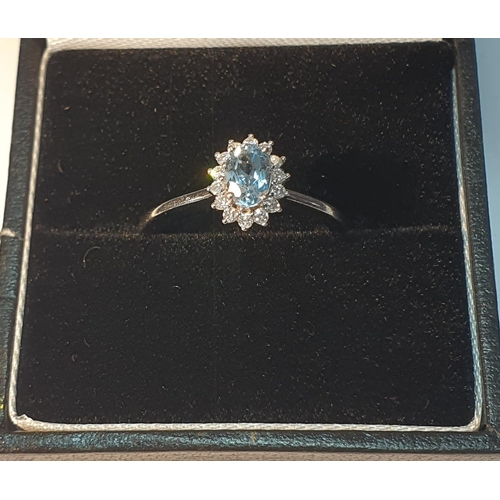 20 - 18ct gold topaz and diamond cluster ring, hallmarks for Sheffield, ring size L1/2, 2.5gms.