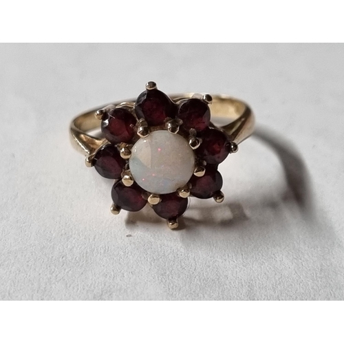 24 - A 9ct Gold Opal and Garnet Ring. Ring size M.