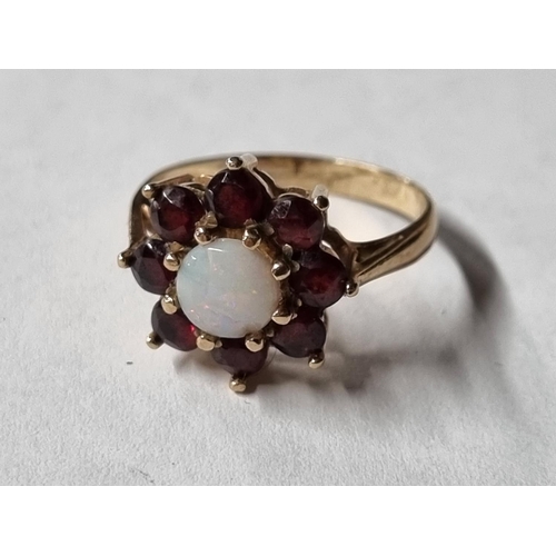 24 - A 9ct Gold Opal and Garnet Ring. Ring size M.