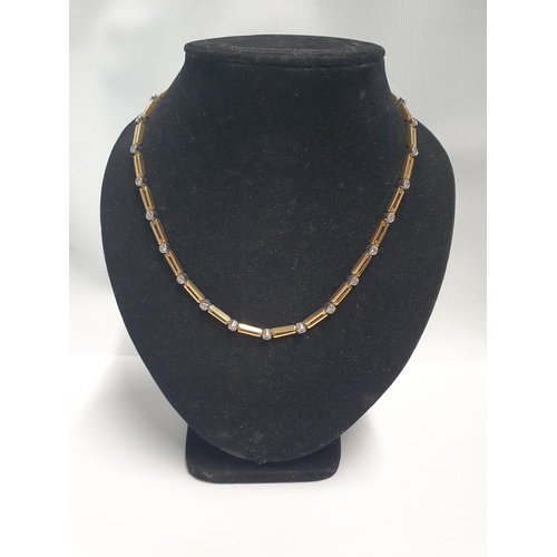 29 - An 18ct Gold and Diamond Necklace, the link chain supporting 27 birlliant cut Diamonds. Total weight... 