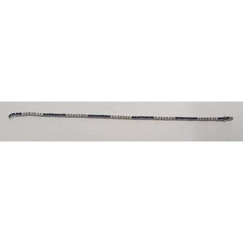32 - A fabulous Platinum, Diamond and Sapphire Tennis Bracelet, with forty Brilliant cut Diamonds and for... 