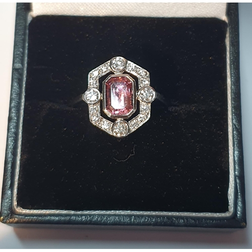 41 - A pink tourmaline and brilliant-cut diamond cluster ring. Tourmaline calculated weight 1.10cts, base... 