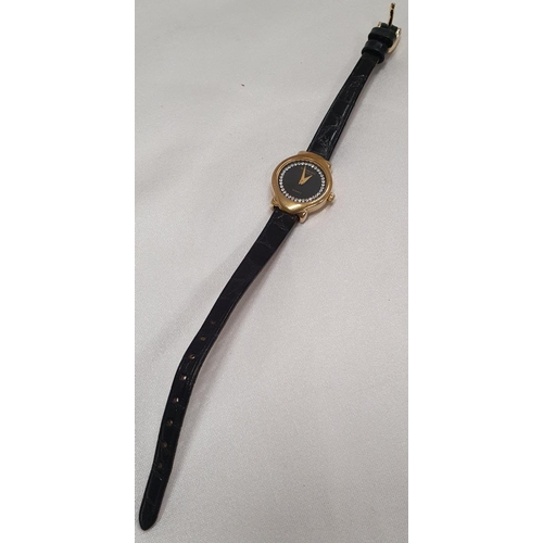 46 - A Raymond Weil ladies wrist Watch with an 18ct Gold plated Case and Black leather Strap.