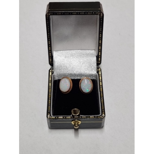 22c - A nice pair of antique Gold and Opel Earrings.