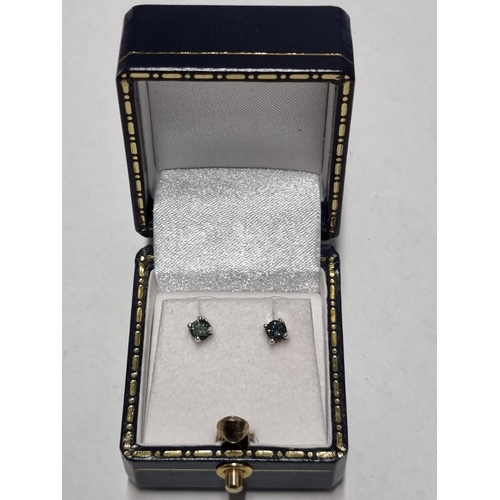 27 - A pair of white Gold and blue Diamond Earrings, Approx Diamond weight .4ct