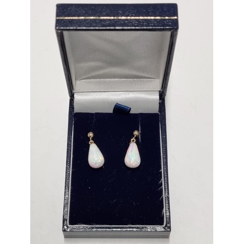 28 - A pair of Gold and Opel Earrings.