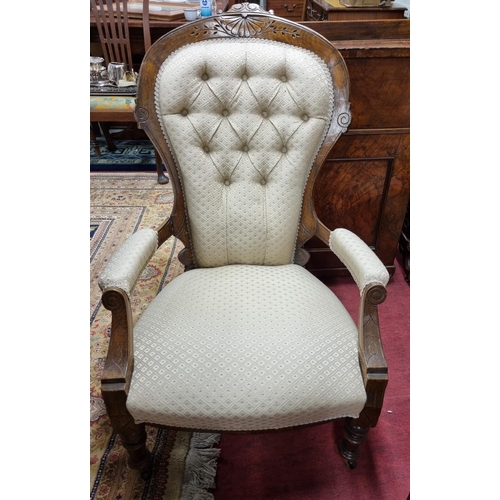 40 - A 19th Century Walnut Armchair with lovely gold patterned upholstery, with turned front supports. 99... 