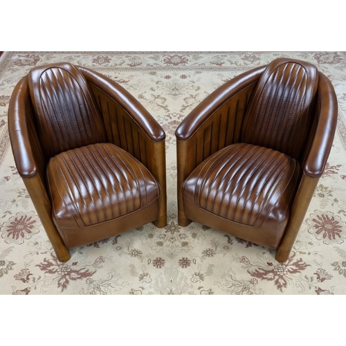 A fantastic pair of Art Deco style brown Leather Aviation style Tub Chairs with reeded outline. H 43 x D 80 x W 71 cm approx.
